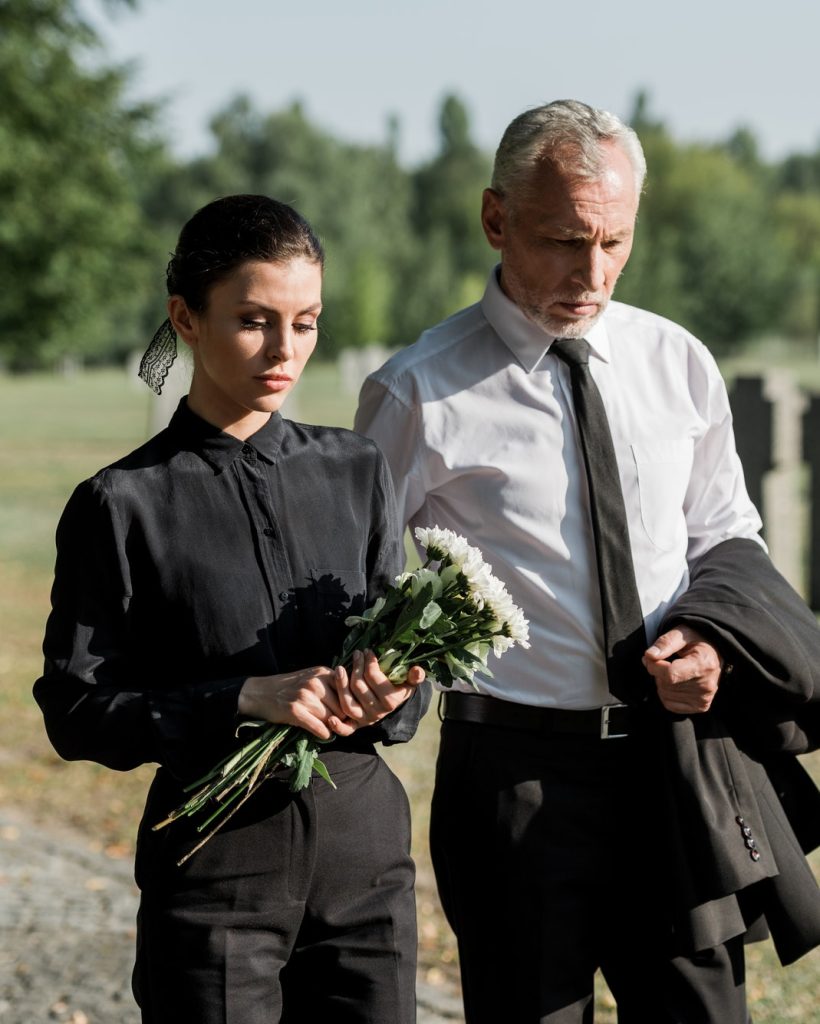 bearded-senior-man-walking-near-woman-with-flowers-on-funeral.jpg bearded-senior-man-walking-near-woman-with-flowers-on-funeral.jpg