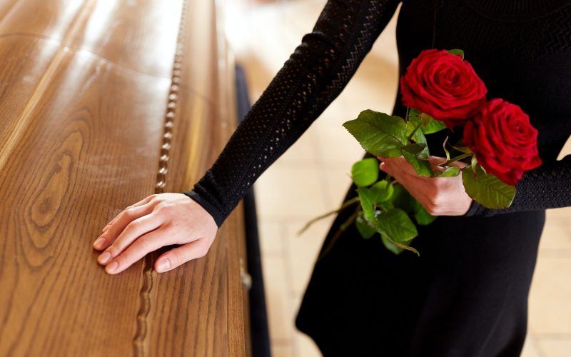 woman-with-red-roses-and-coffin-at-funeral-1.jpg woman-with-red-roses-and-coffin-at-funeral-1.jpg